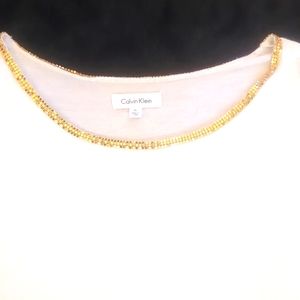 Women's white Calvin Klein rayon/spandex T-shirt w/gold trim collar. Size XL.